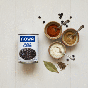 An-overhead-view-of-the-simple-pantry-ingredients-for-black-bean-tacos-a-can-of-black-beans-and-small-bowls-of-spices.