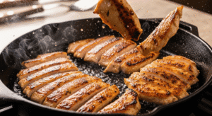 Thinly sliced chicken getting a perfect golden-brown sear in a hot wok, a key step for a delicious 5-minute stir-fry.